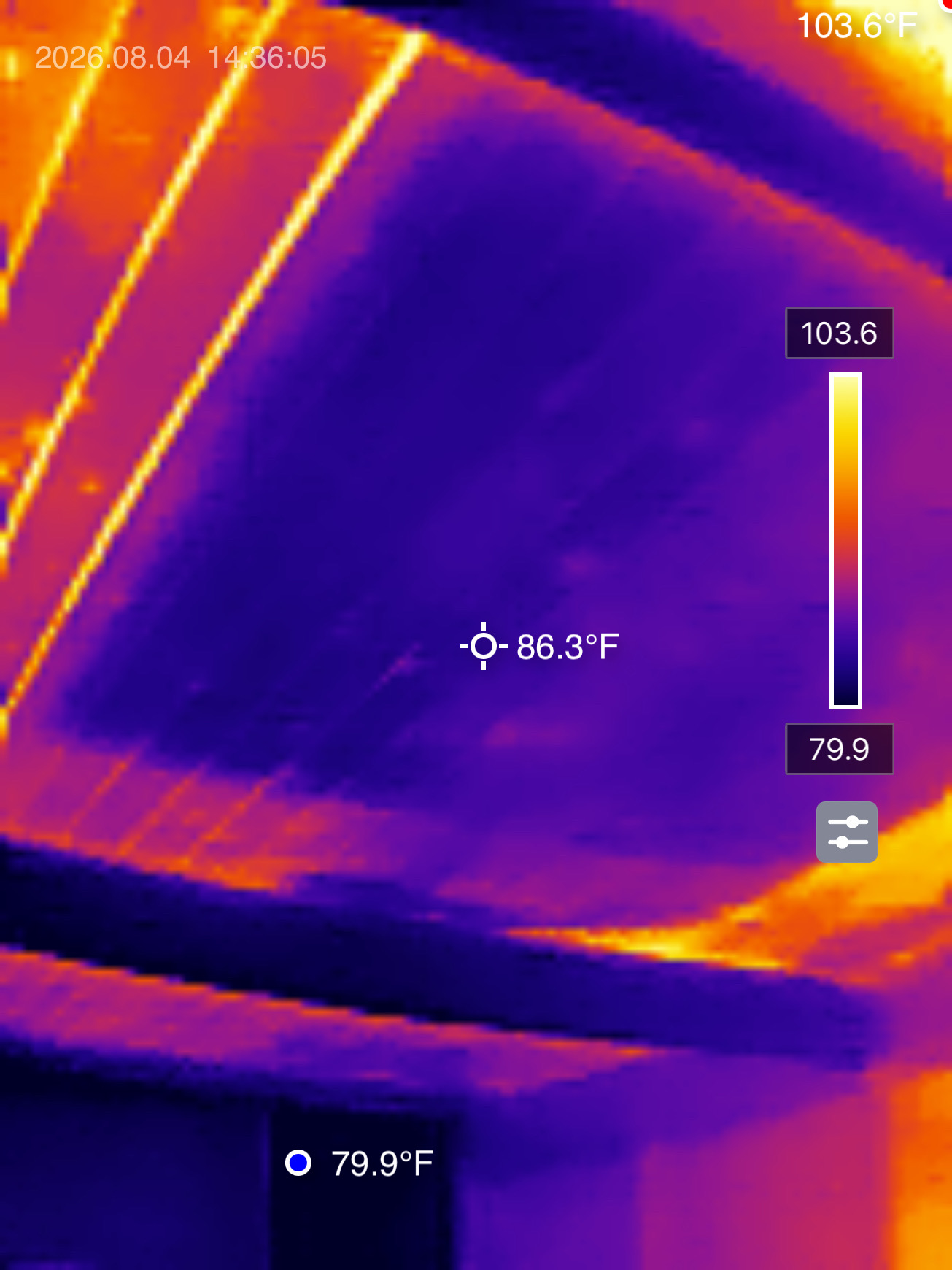 Interior thermal camera image of a wood plank ceiling in Altadena, California, showing the CryoPaint-coated roof section reading 86.3°F while the surrounding untreated ceiling reads over 100°F.